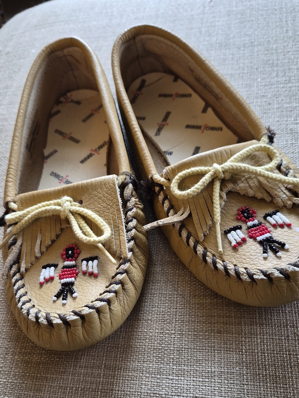 Minnetonka Tan Beaded Fringe Moccasins For Women.